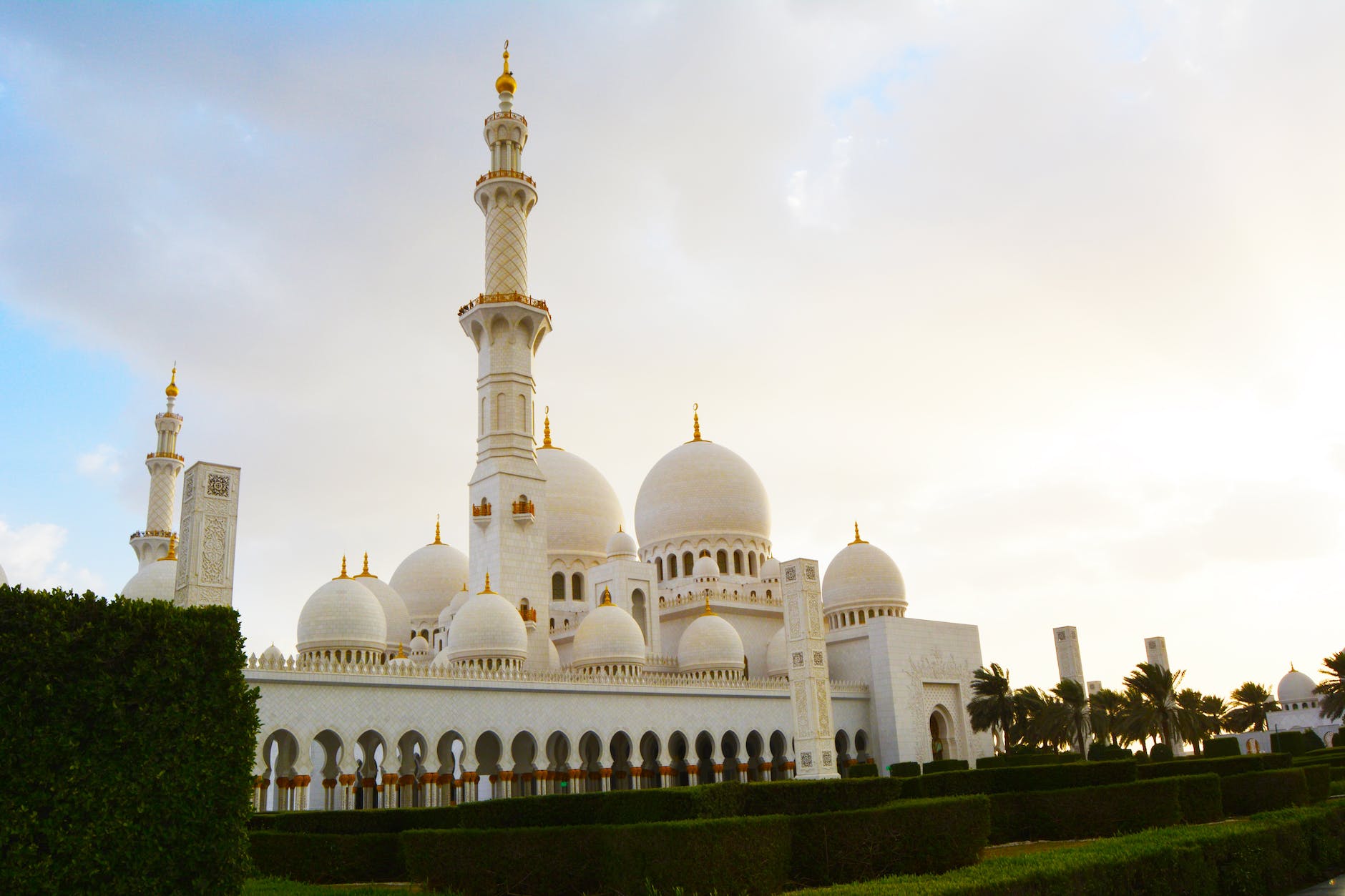 white mosque near trees