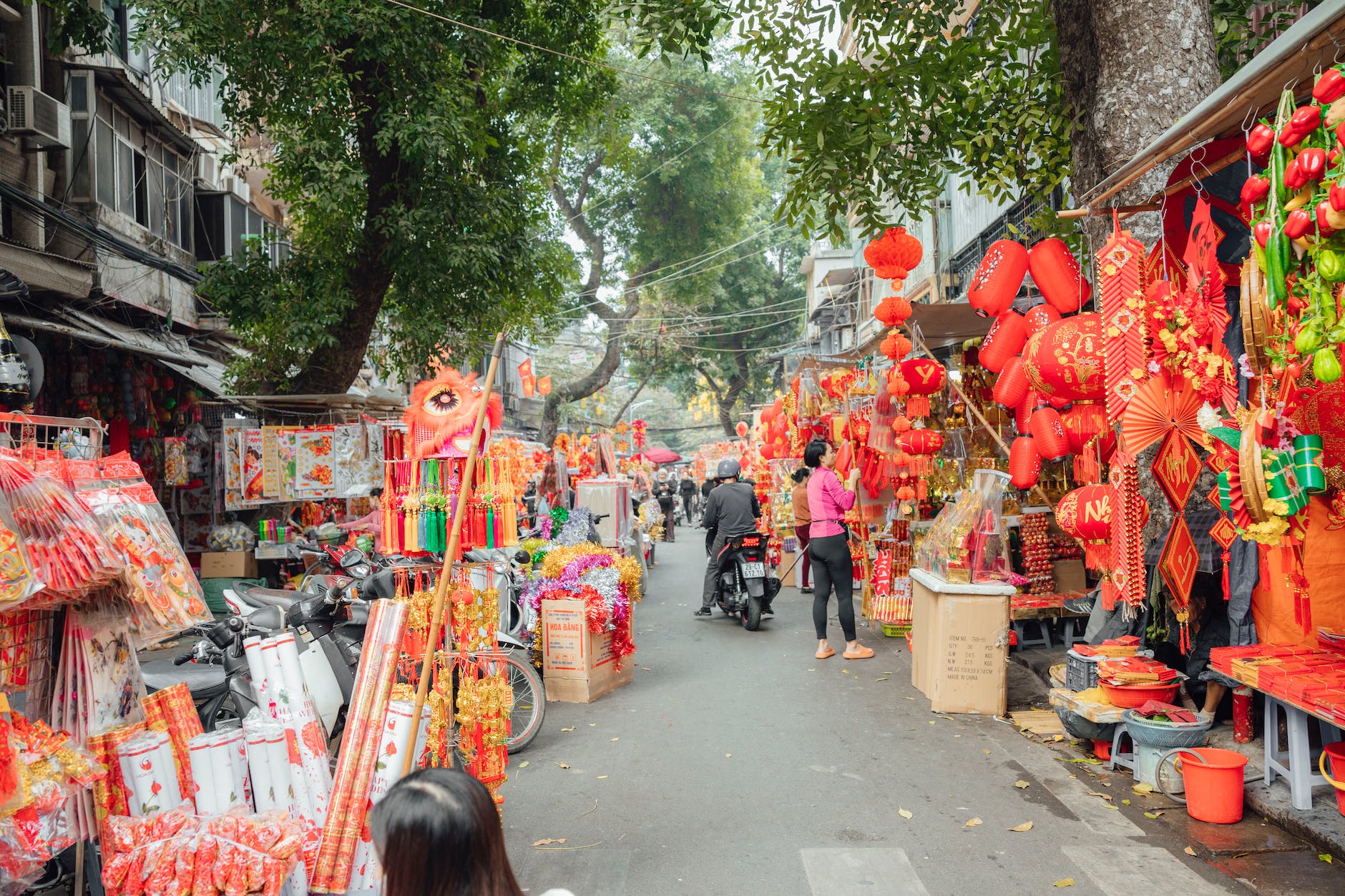 stalls selling chinese new year decorations on the side of the street