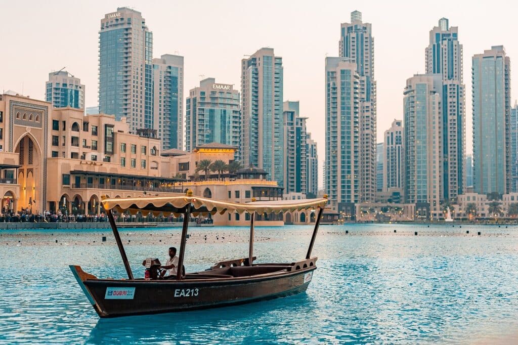 A boat sailing near Dubai's city skyline, offering a picturesque view of the city. Perfect for things to do in Dubai.