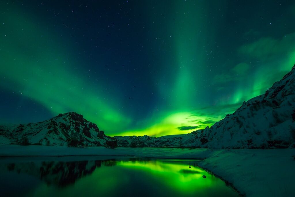 Stunning image of aurora borealis reflected in water in Iceland.