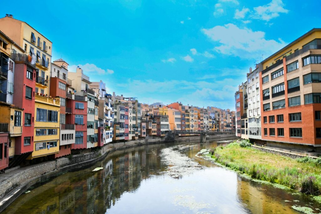 Vibrant buildings along river in Catalonia, Spain.