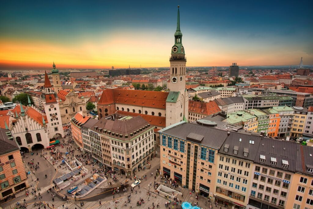 Munich, Germany skyline at sunset with colorful sky and city lights. best places to travel in may