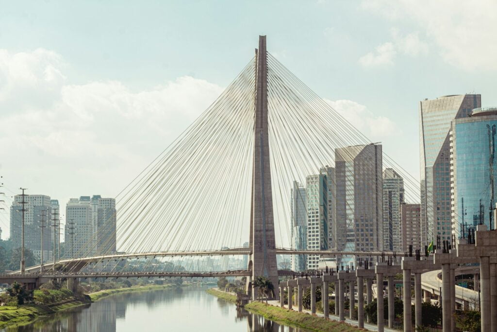 gray concrete bridge over river - Brazil Travel Guide