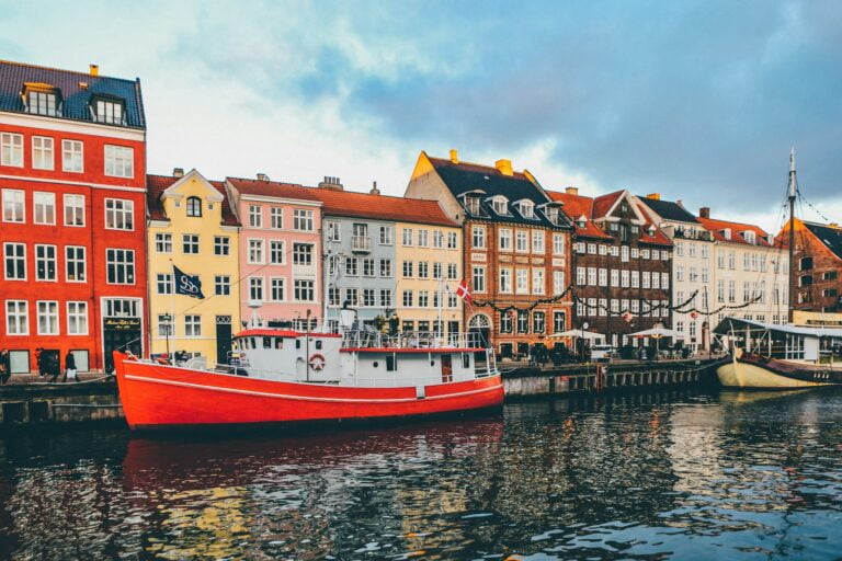 red and white concrete building - Explore Copenhagen: 15 Best Things to Do for Unforgettable Experiences