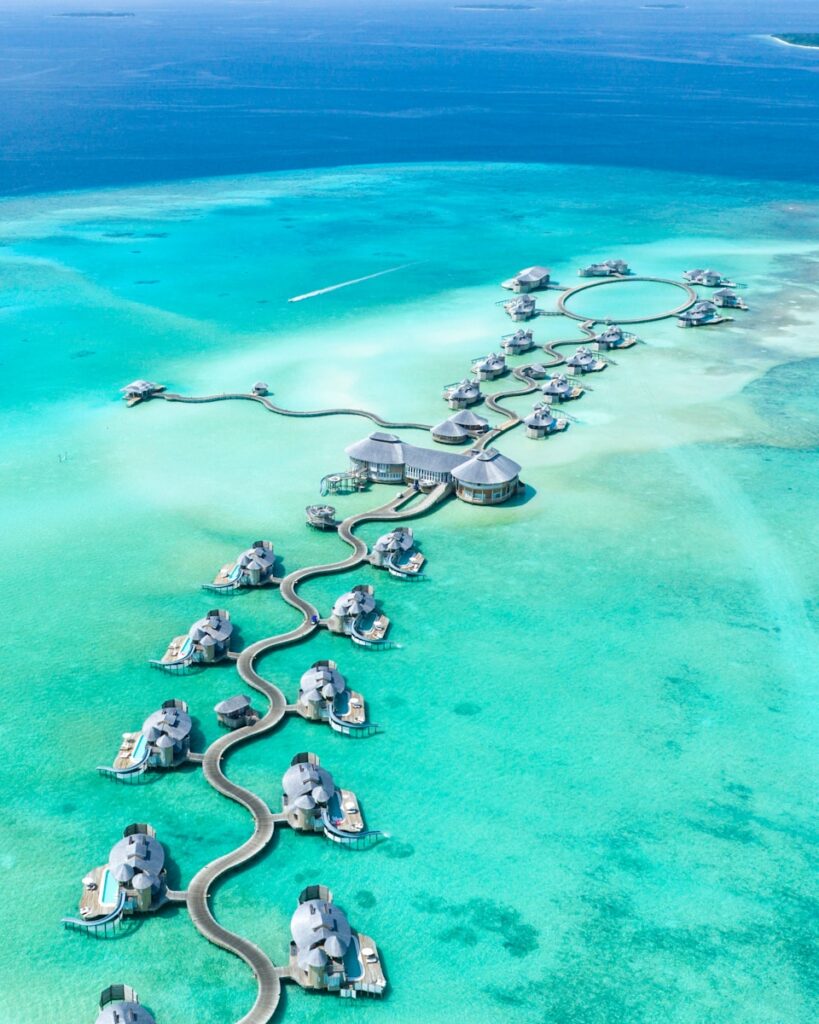 gray building surrounded by body of water in Maldives