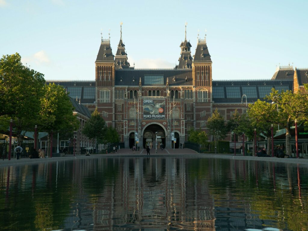 brown concrete building near body of water during daytime - Top 10 Things to Do in Amsterdam