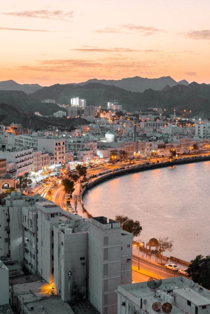 aerial view of city buildings near body of water during daytime - Places to Visit in the Middle East