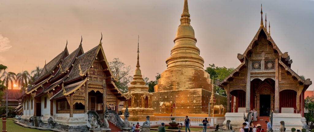 a group of people standing in front of a building, the best hotels in Chiang Mai.