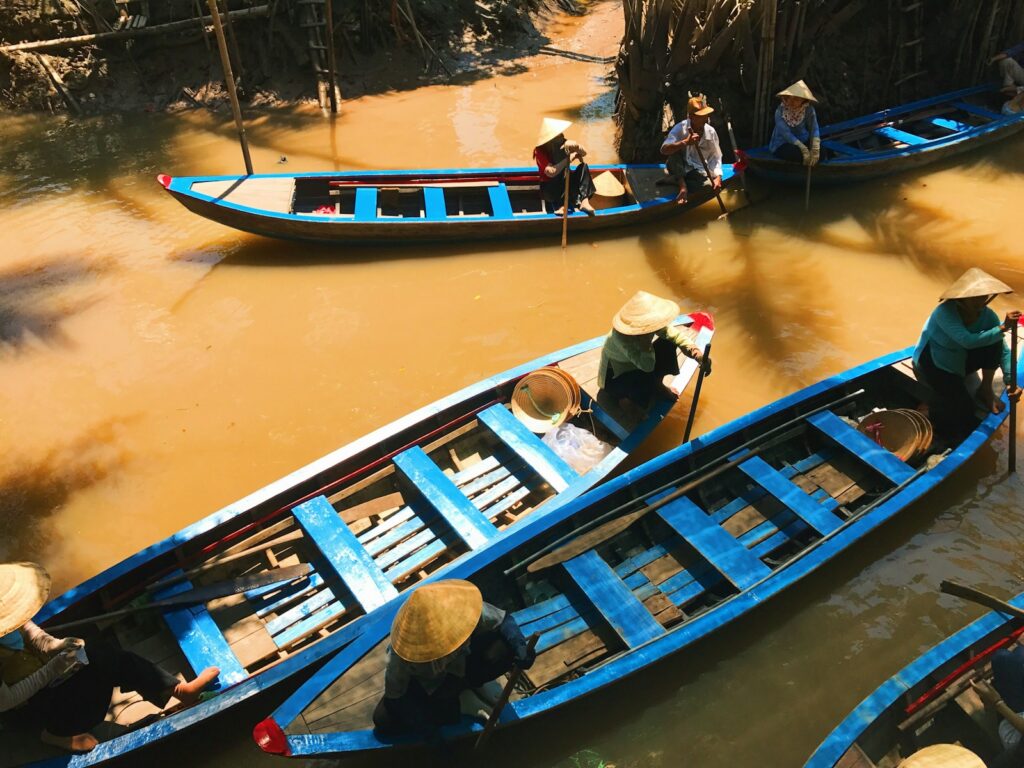 people sitting on boats